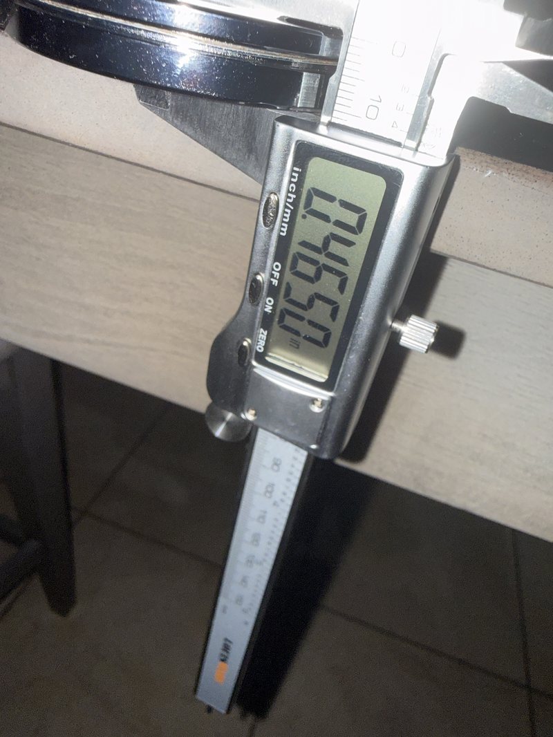 Calipers reading 0.4650 inches for the height of the disc