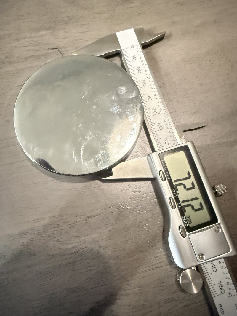 Calipers reading 72.12 millimeters across the narrow step of the disc